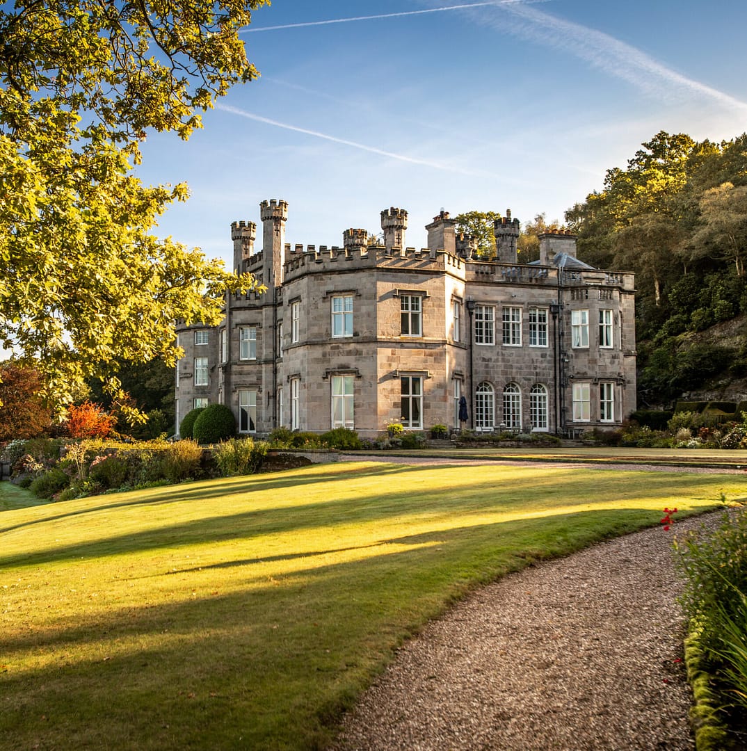 Bolesworth Castle in Cheshire pictured in autumn surrounded by lush green gardens