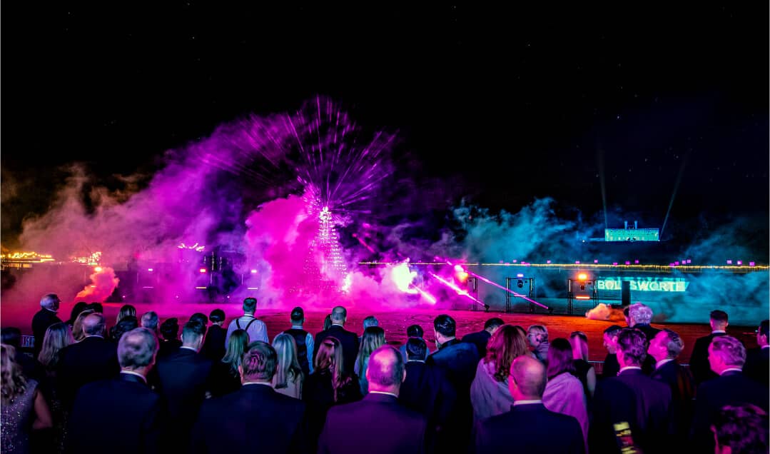 Firework display over the Bolesworth grounds as guests enjoying the vibrant atmosphere.