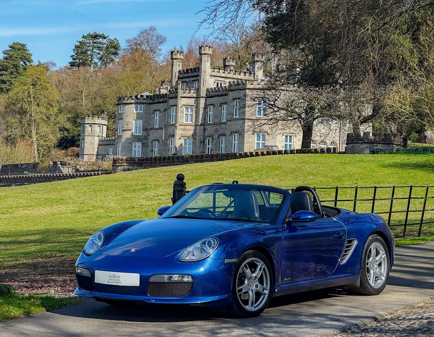 Blue Porche parked up in front of Bolesworth Castle