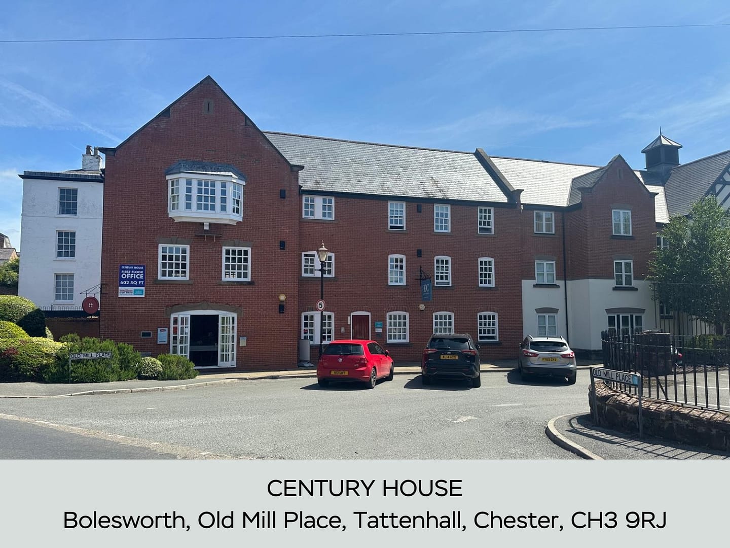 A large Bolesworth commercial property in Tattenhall village in Cheshire with vehicles parked outside.
