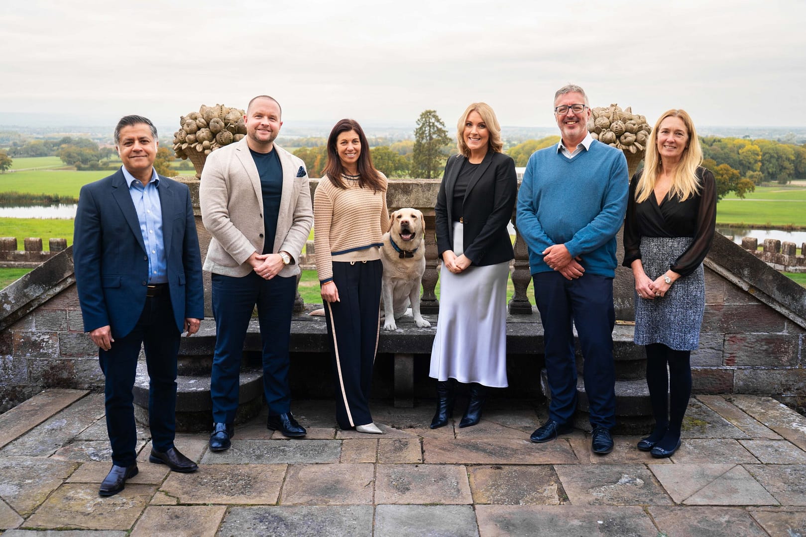 A group of 6 people standing in the gardens of Bolesworth Castle